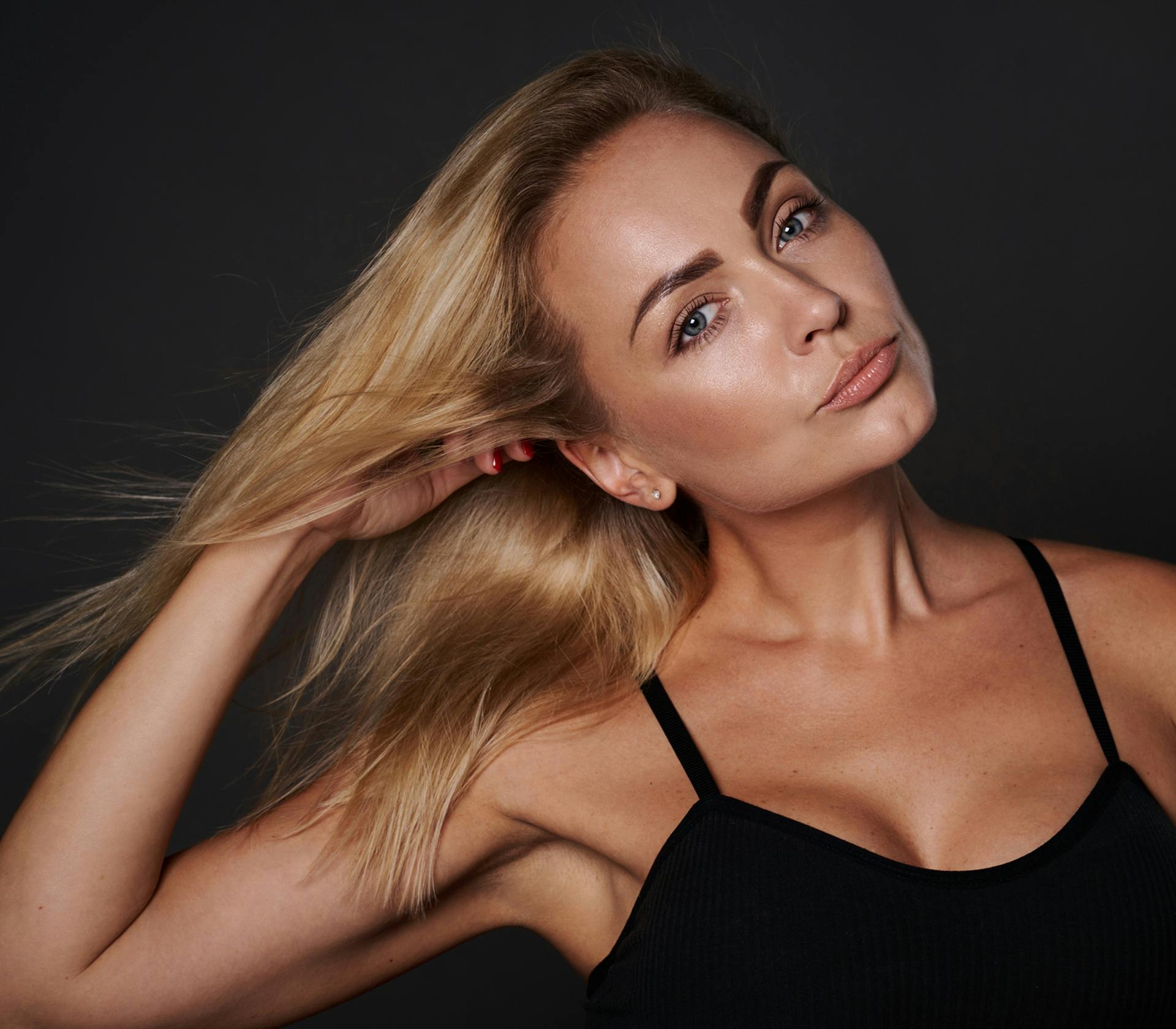 woman touching her hair