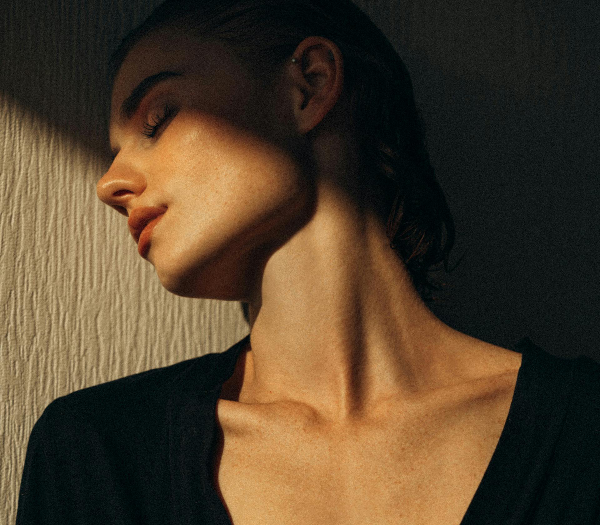 woman half covered in shadowed