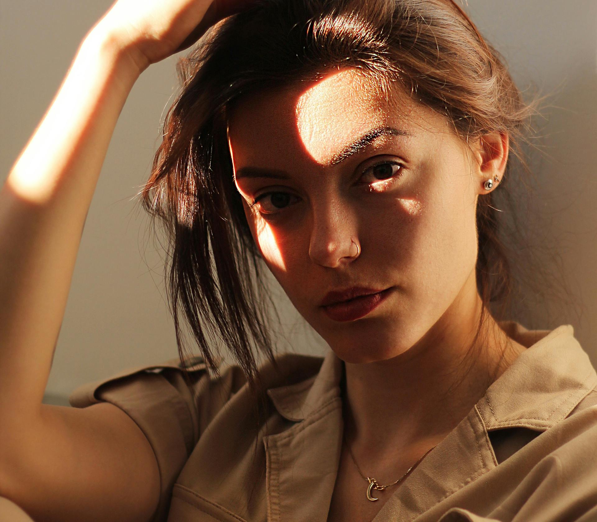 woman running her hand through her hair