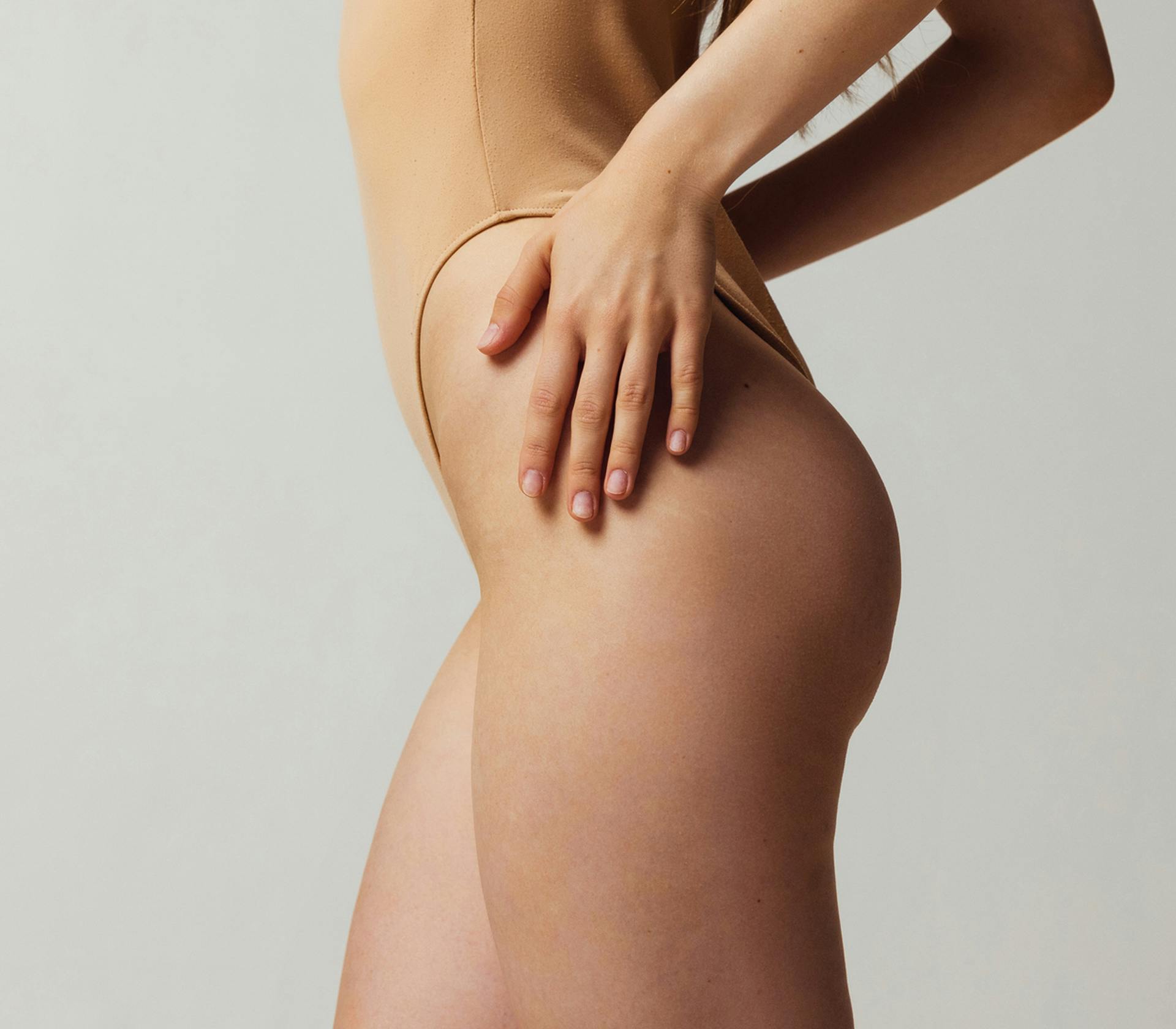 woman touching her hips