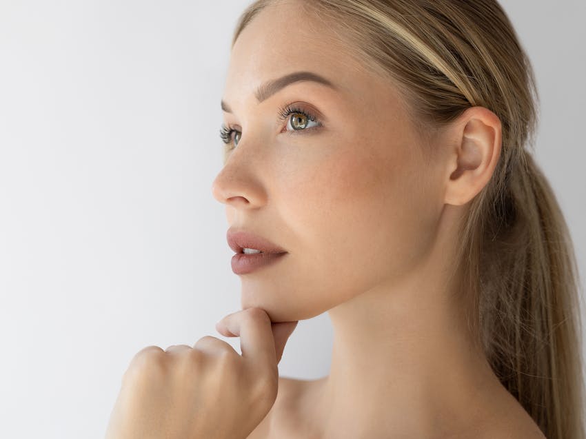 woman touching her chin