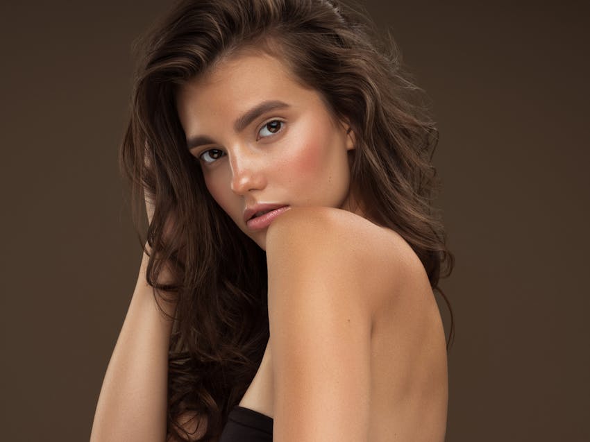 woman looking over her shoulder