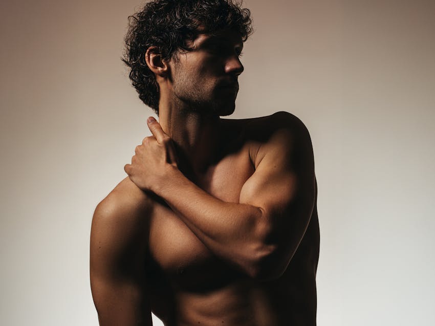 man grabbing his neck