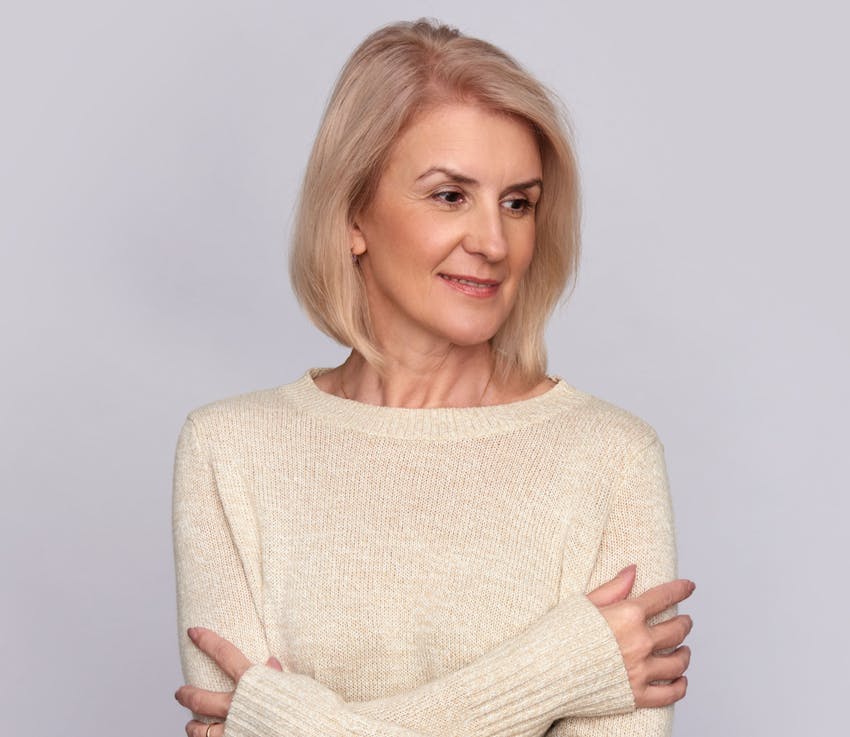 Woman smiling with arms crossed