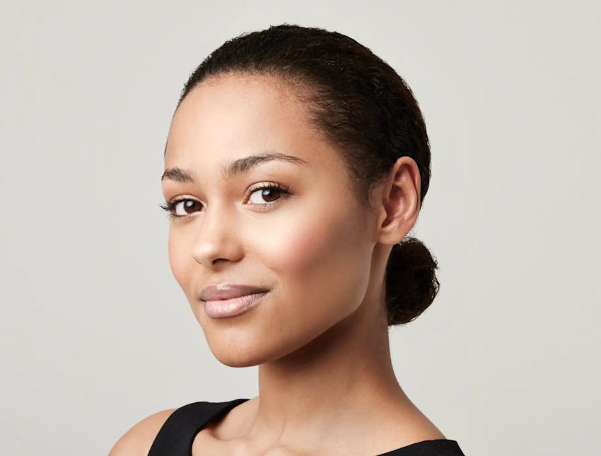 woman smiling looking to the side