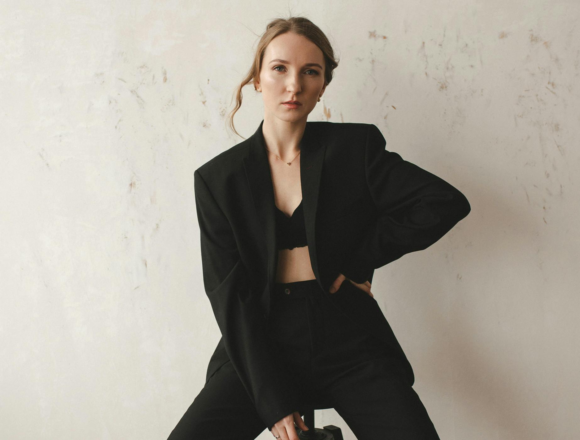 woman sitting on stool