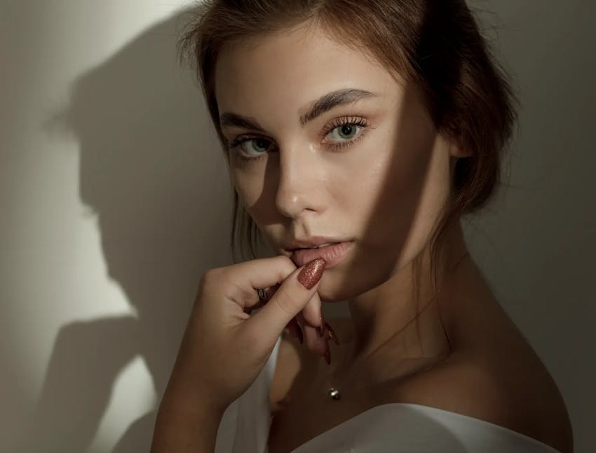 woman with hands on mouth