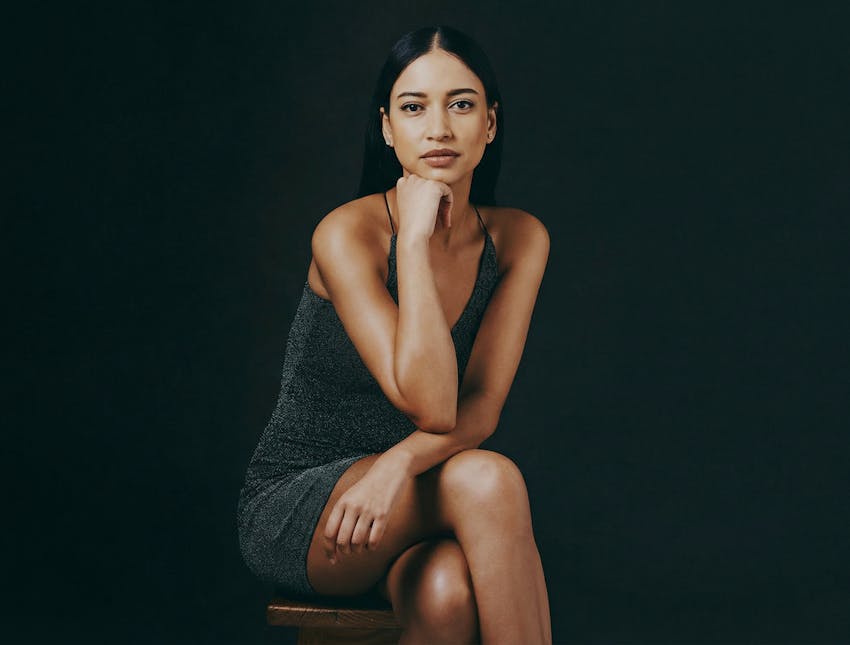 woman sitting with head in hands