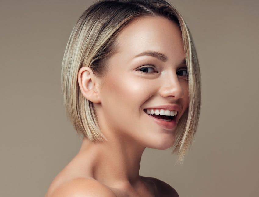 woman smiling looking to the side