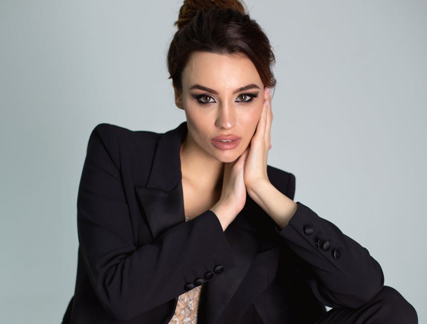 woman sitting with head in hands