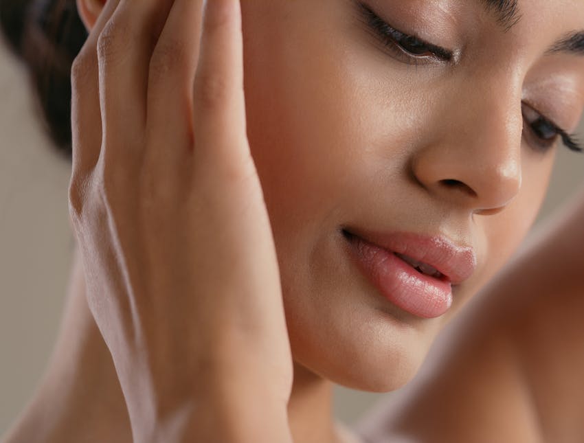 woman with hands on face