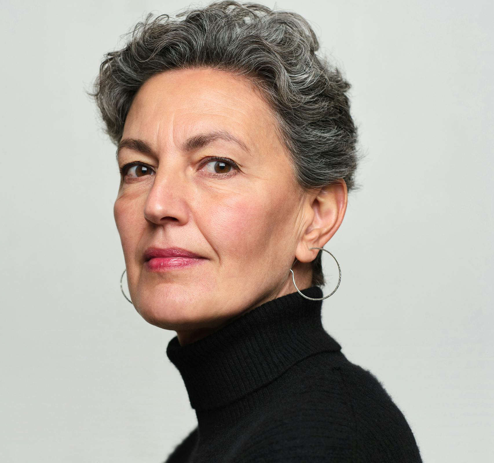 older woman looking over shoulder