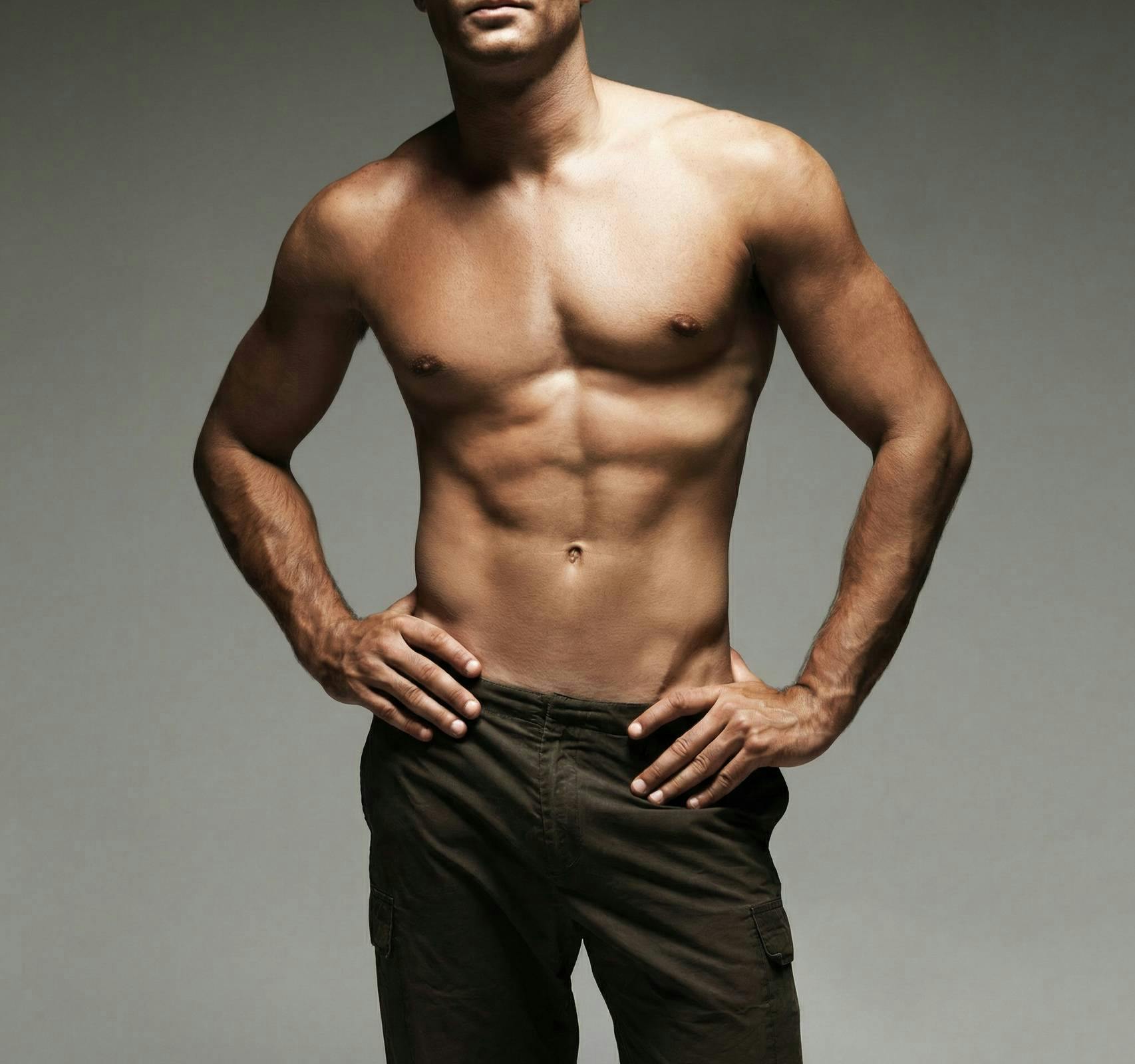 man shirtless with hands on hips