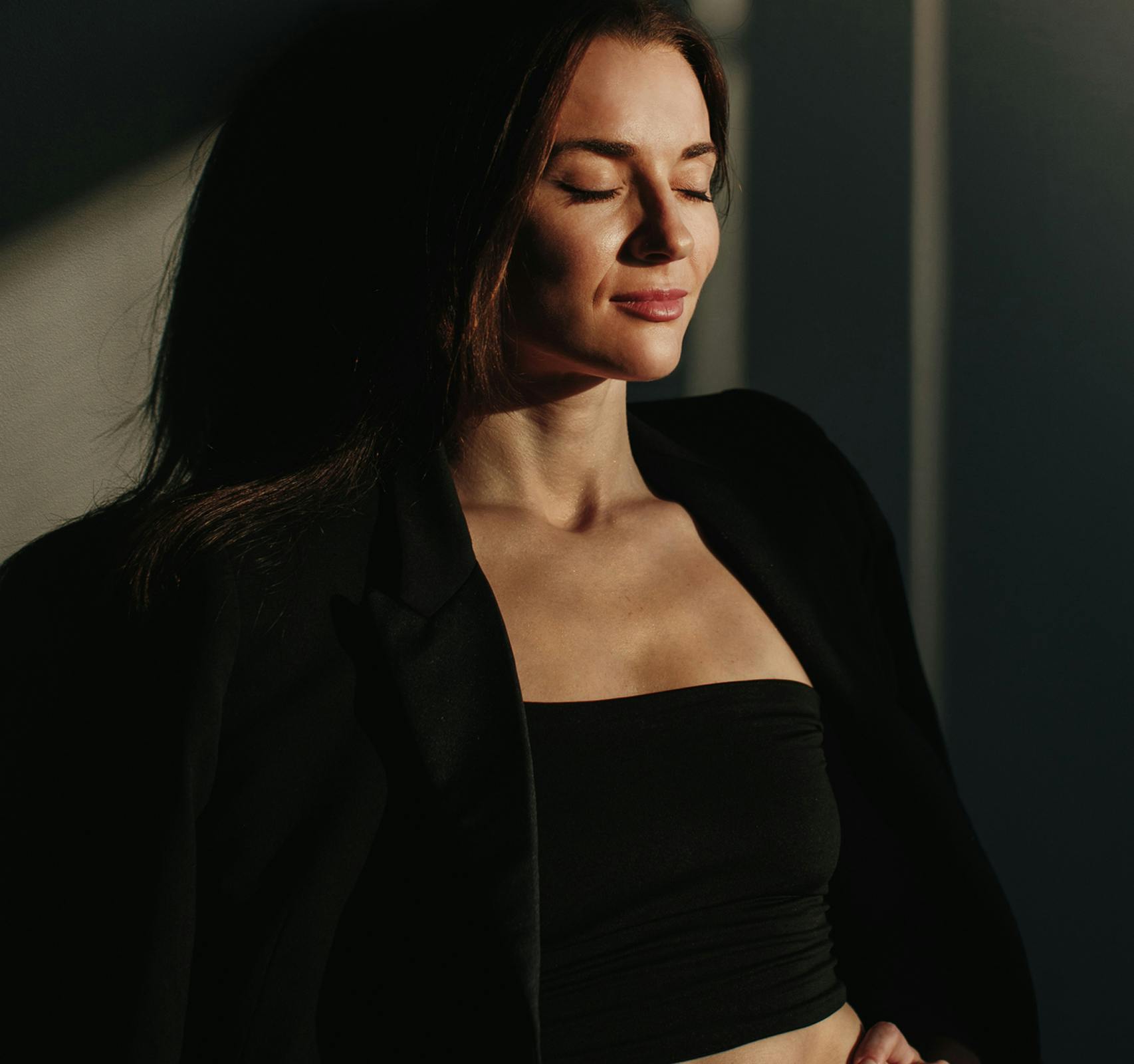 woman leaning against wall