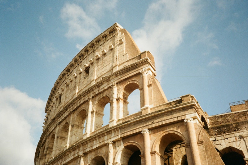 a very old looking building with a clock on it's side