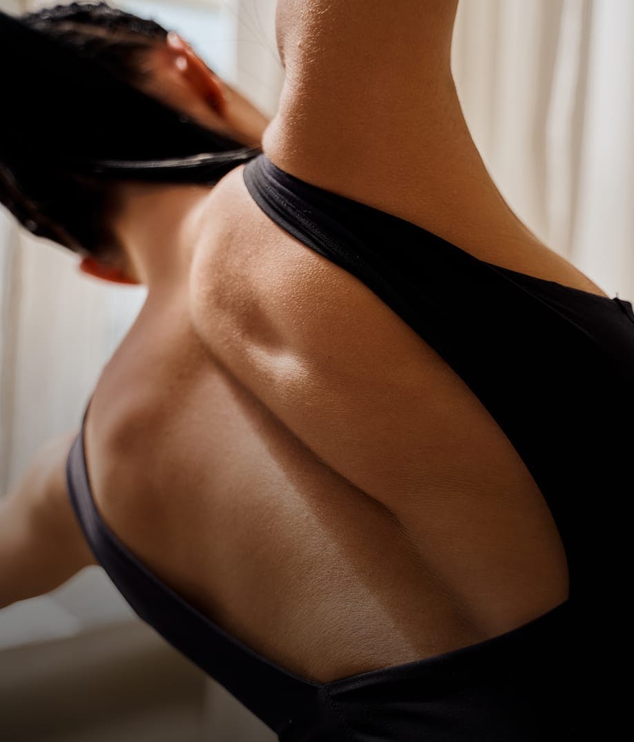 woman's back while stretching