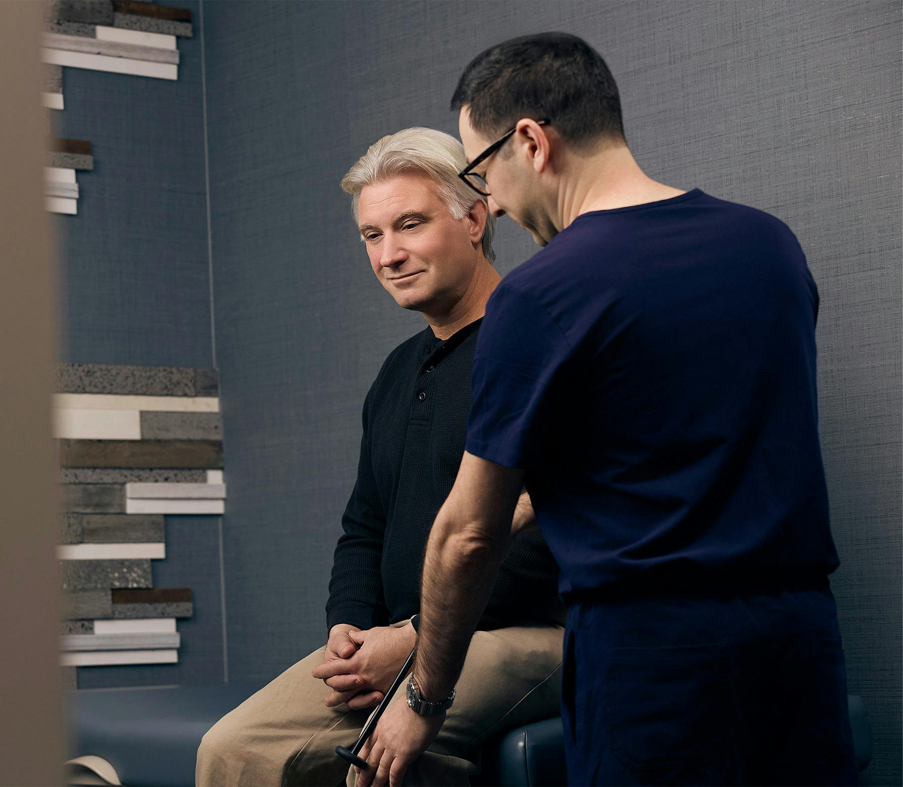 doctor testing a patient's knee