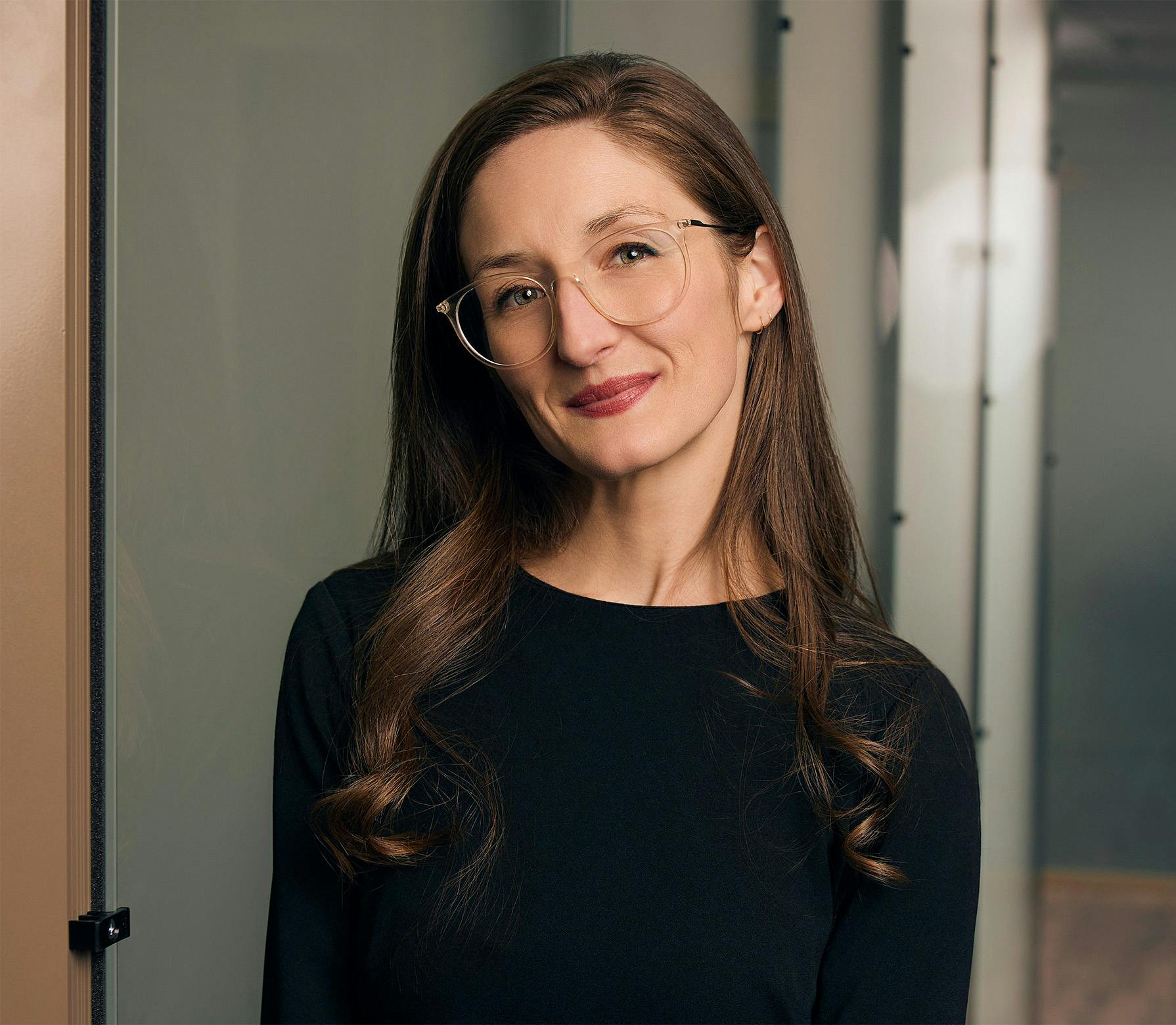 Woman with glasses smiling