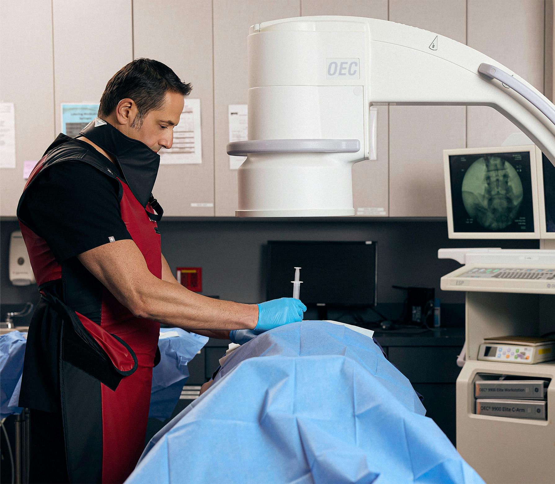 doctor injecting a patient