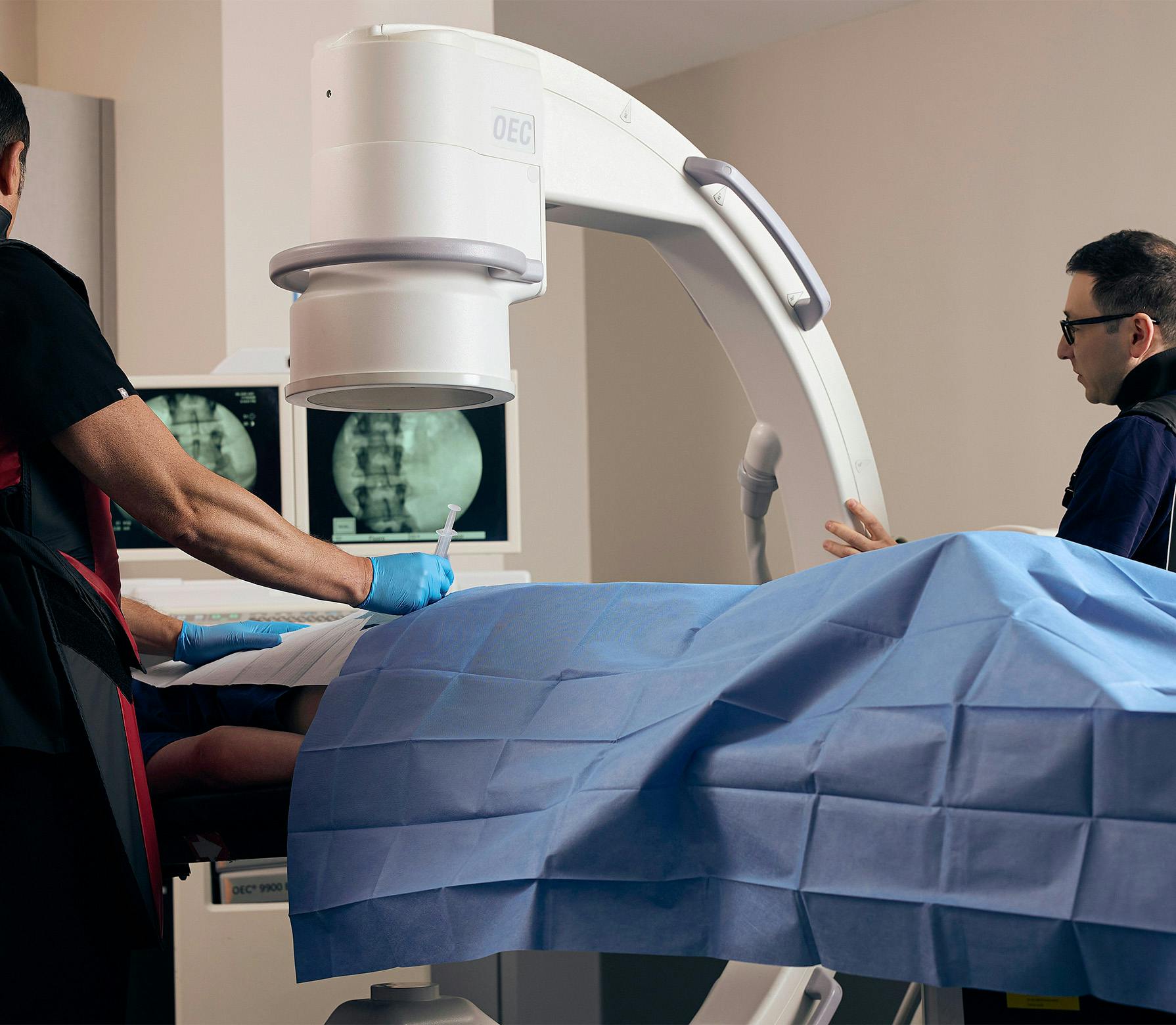 doctor injecting a patient