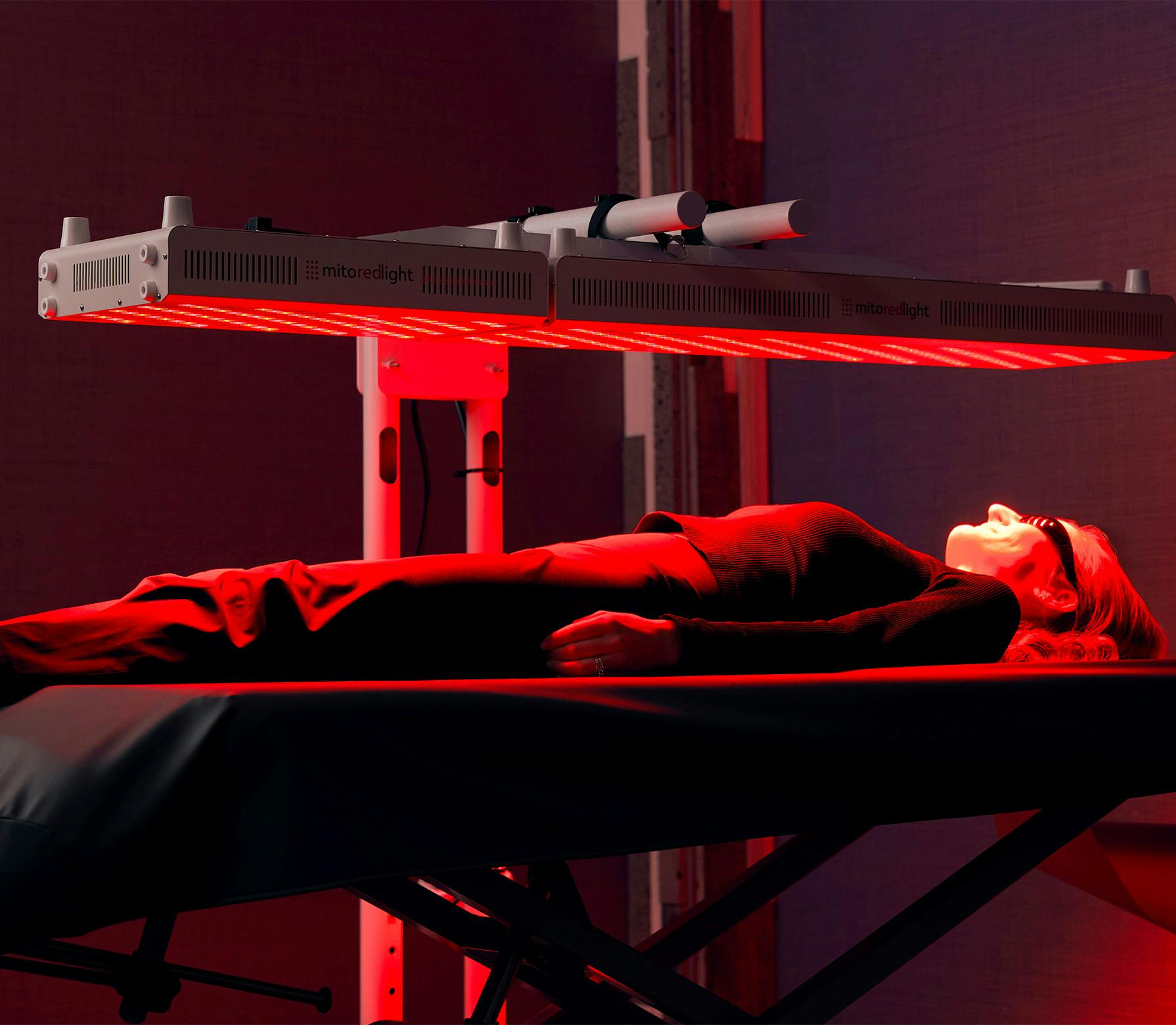 woman laying in red light