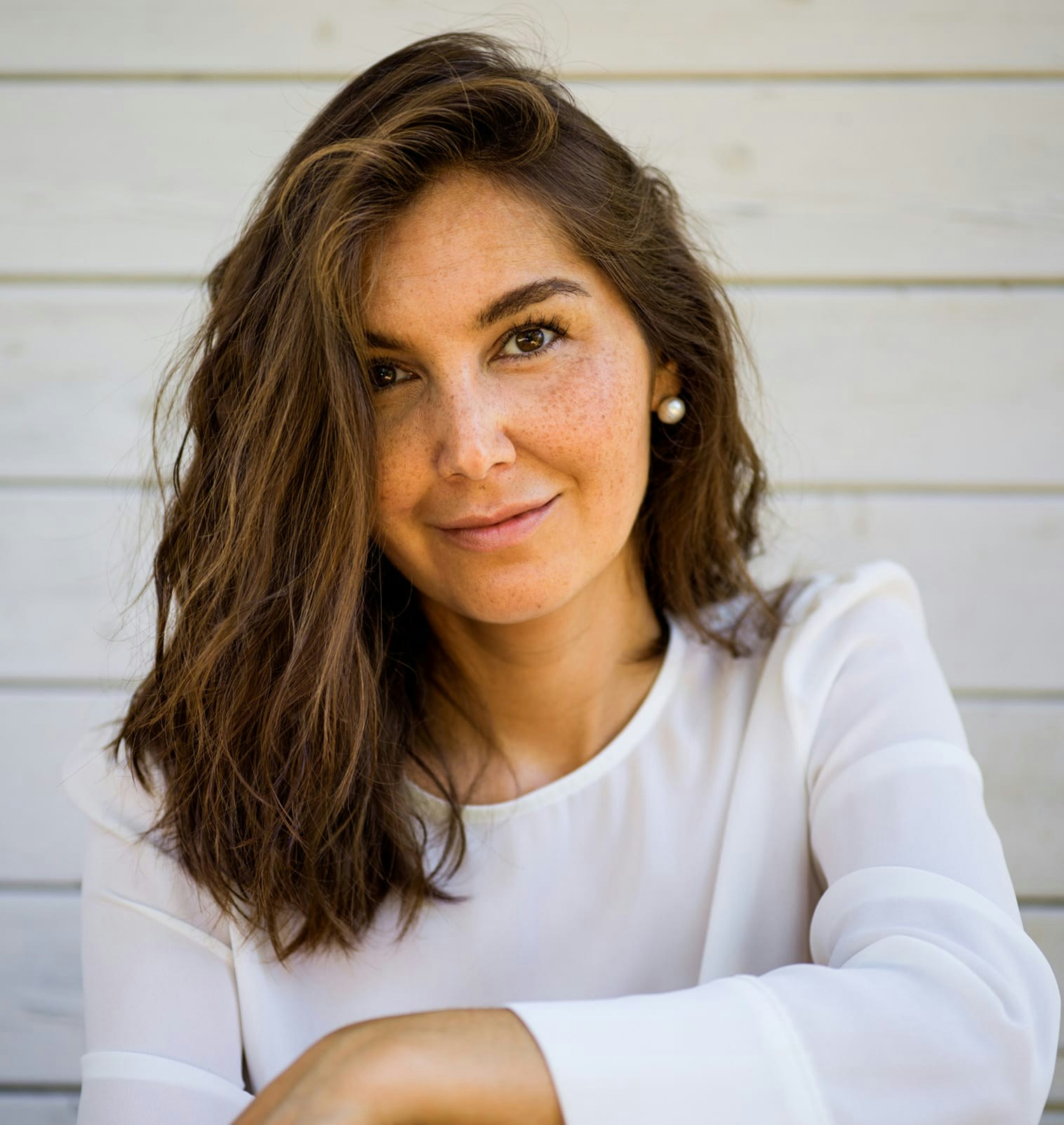 smiling woman in white blouse