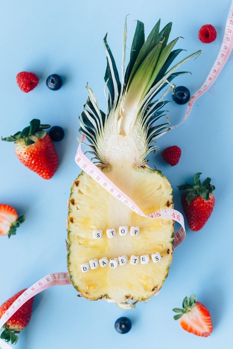 there is a pineapple with a measuring tape around it