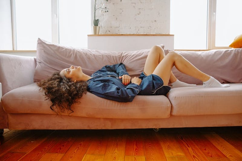 woman laying on a couch