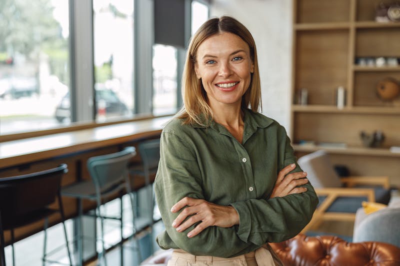 Woman smiling with arms crossed