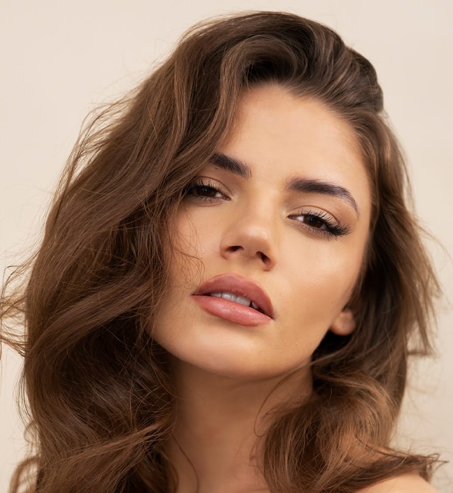 Woman with wavy brown hair