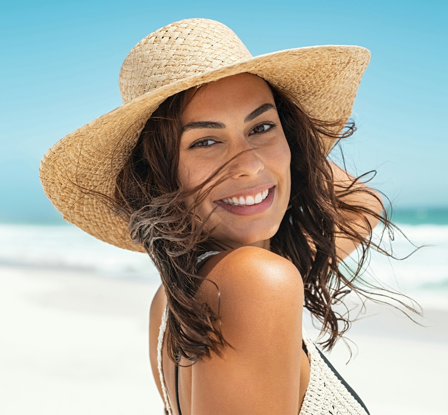 smiling woman in sunhat