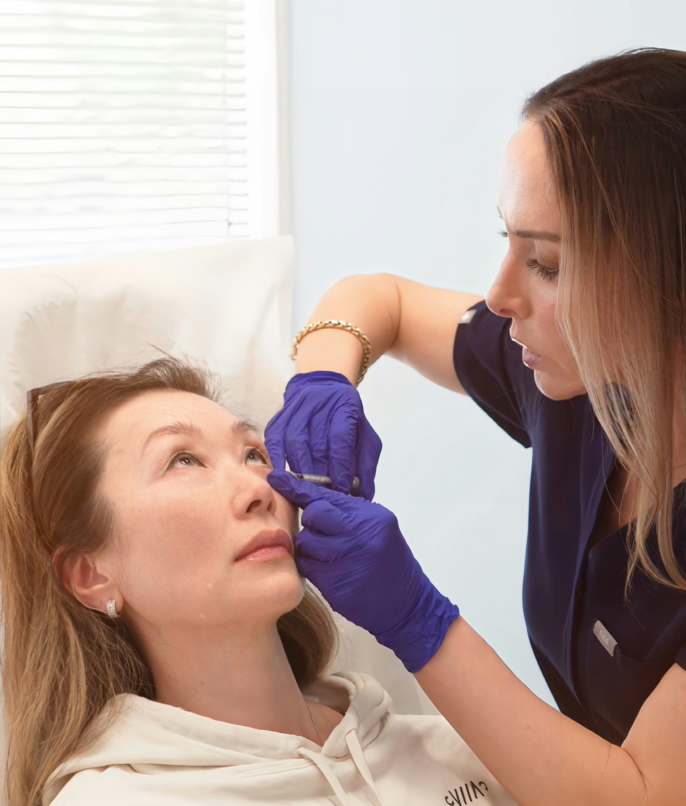 Meghan Morrissette performing injectable treatment
