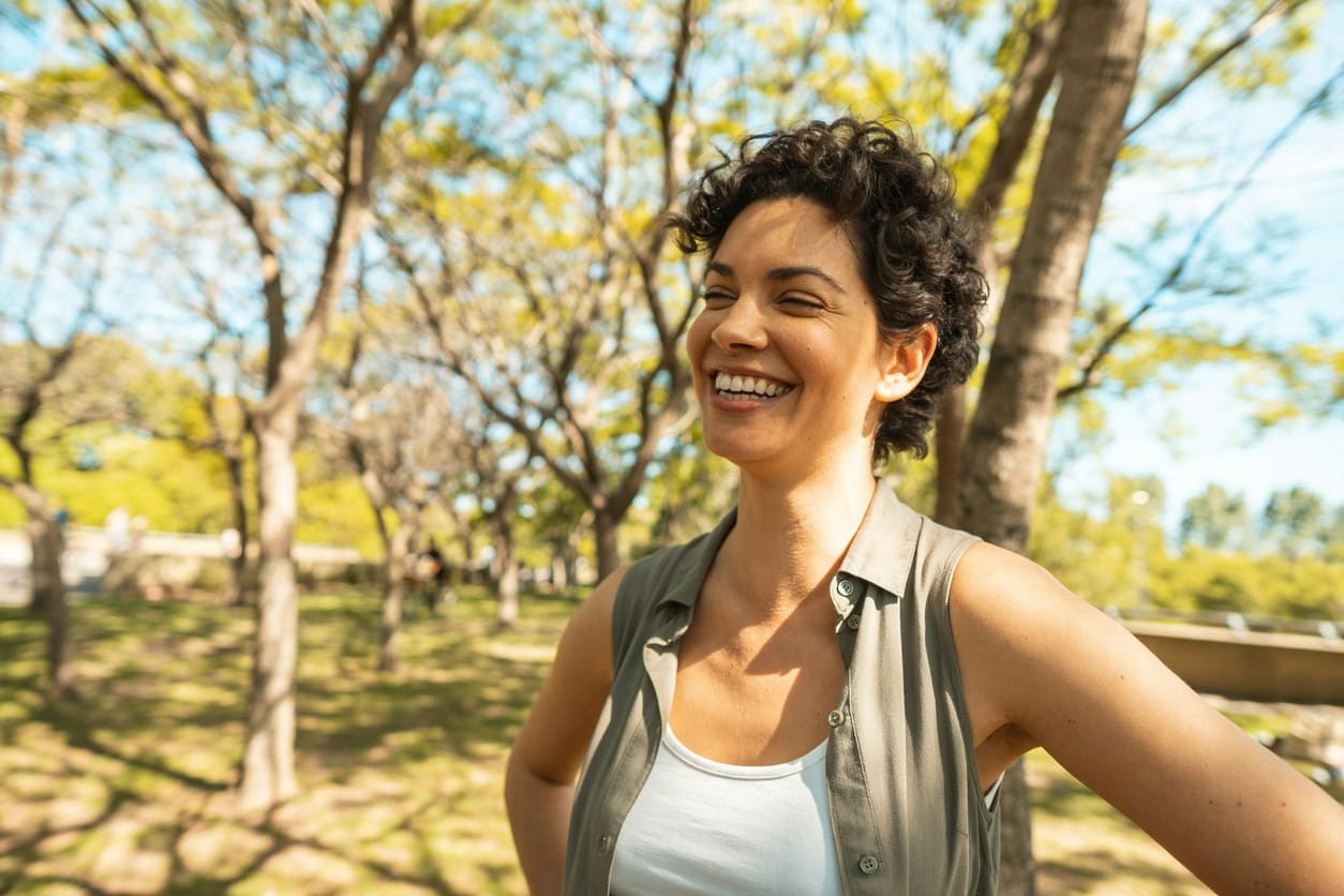 Woman smiling standing outdoors