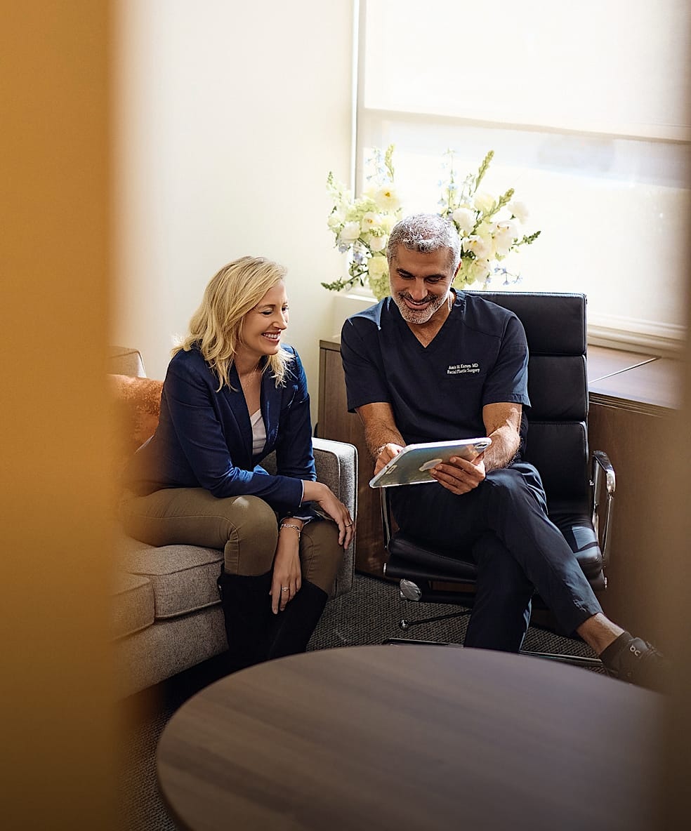 Dr. Karam with a patient