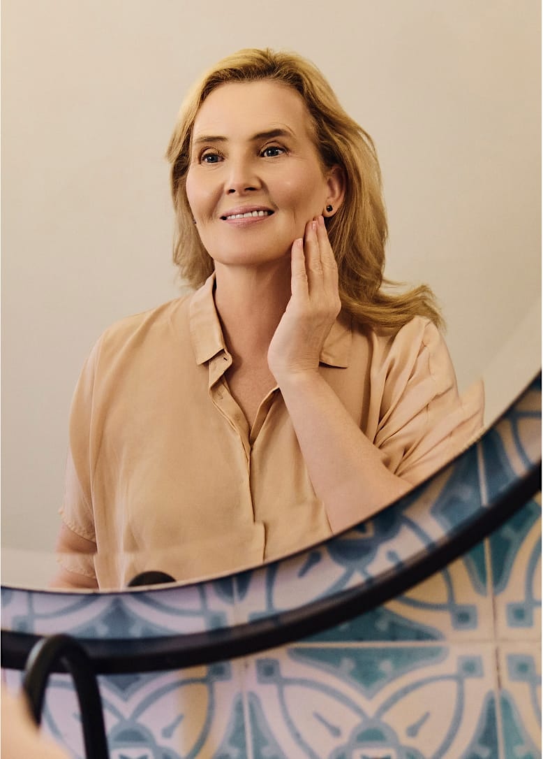 woman looking at her reflection