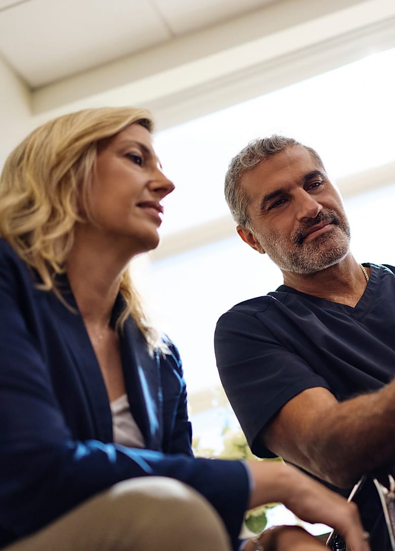 Dr. Karam with a patient