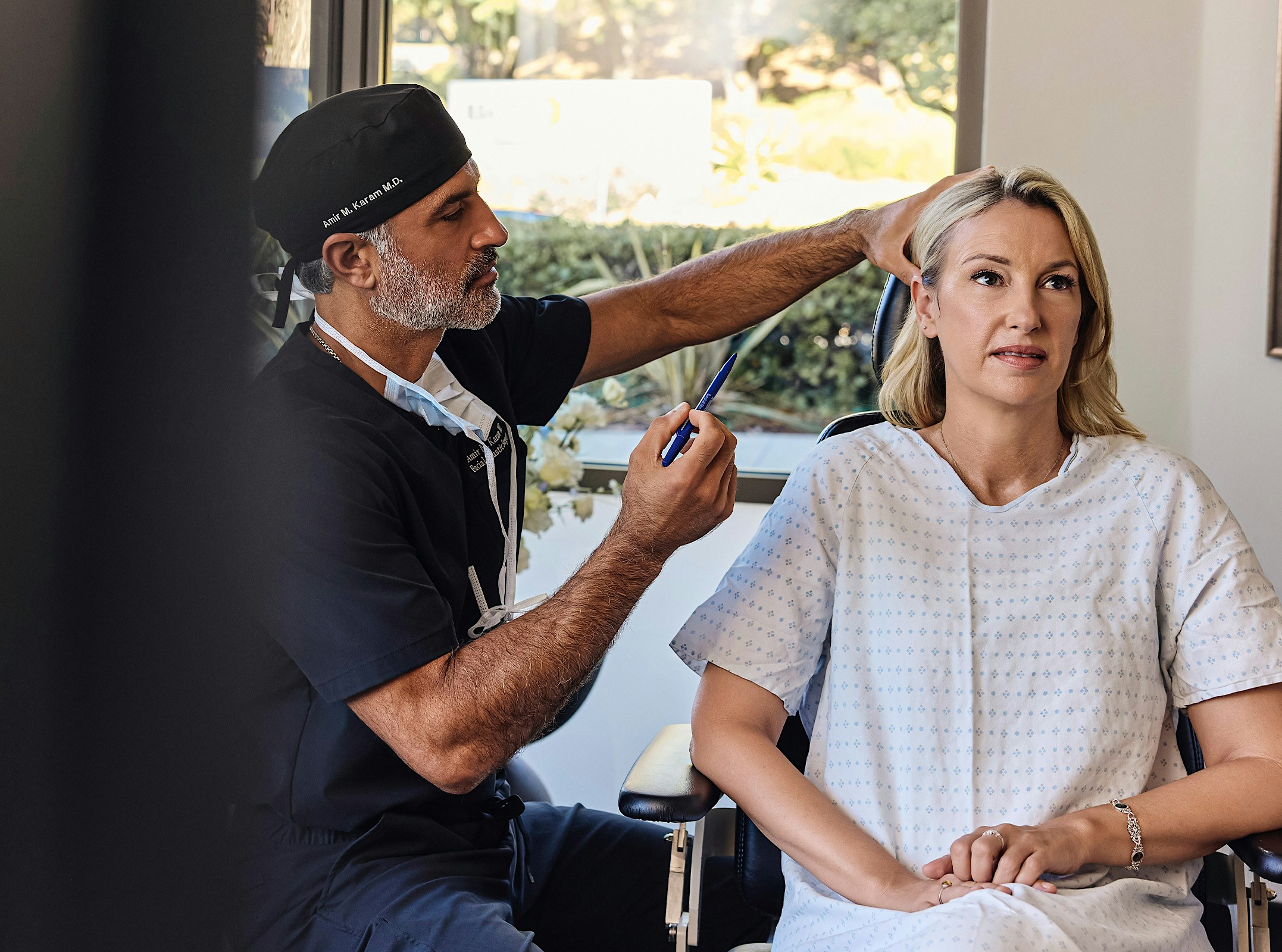 Dr.Karam helping a patient