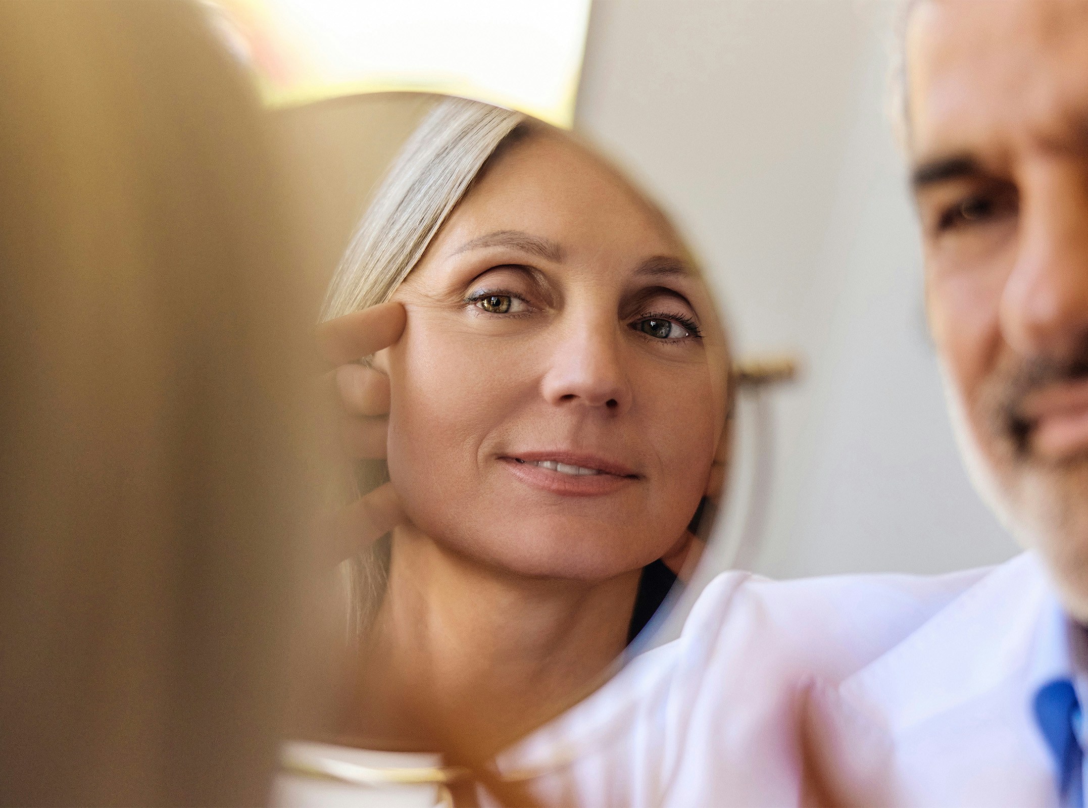 Woman looking in a mirror