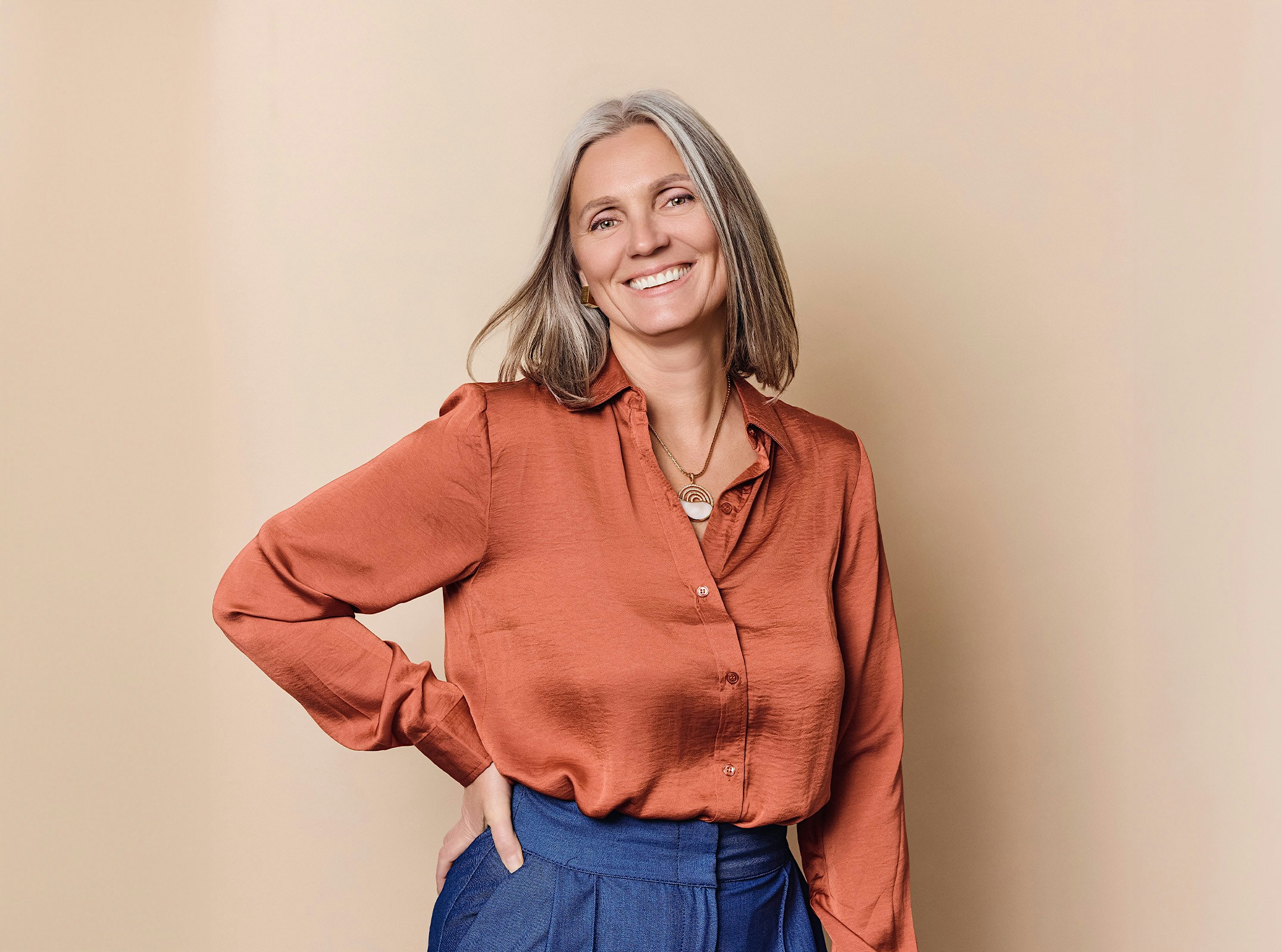 Woman smiling with her hand on her hip