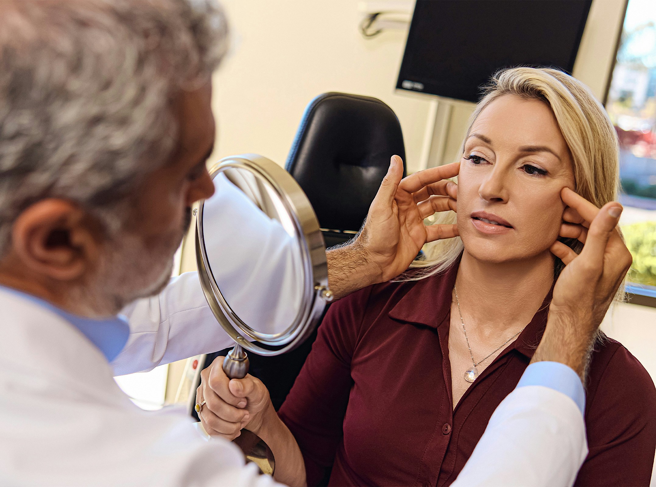 Dr.Karam touching a patients face