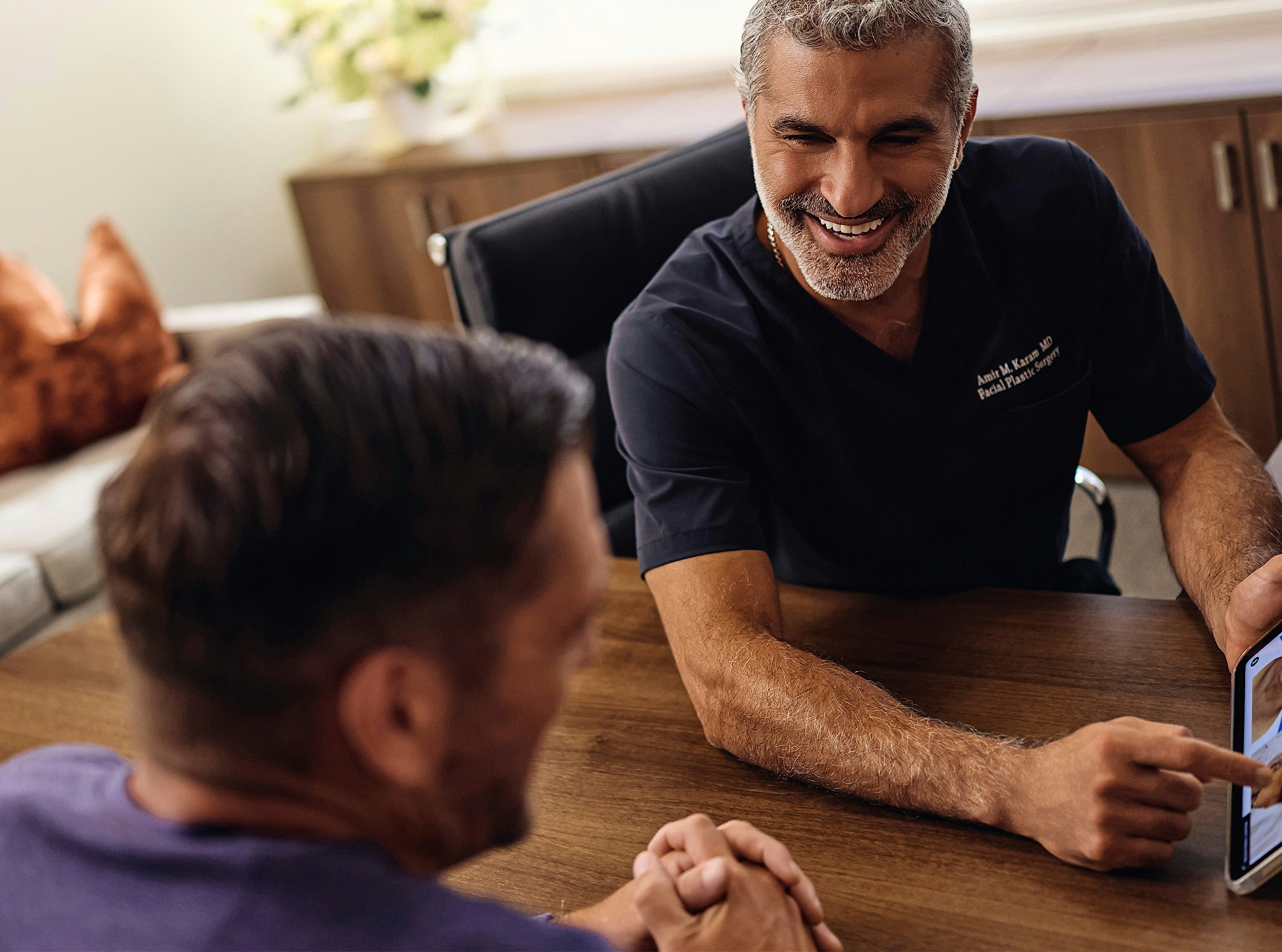 Dr. Karam talking to a patient