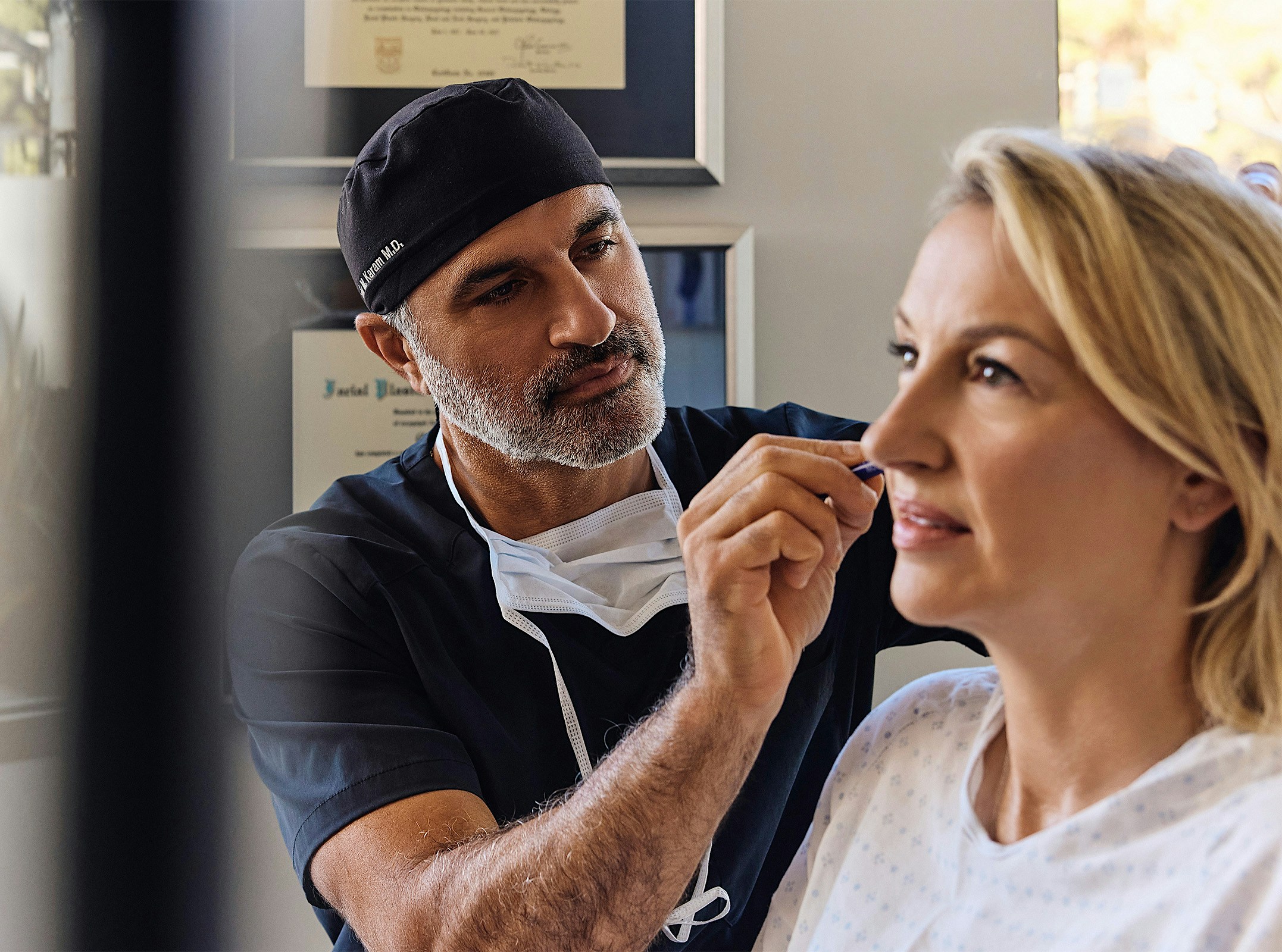 Dr.Karam helping a patient