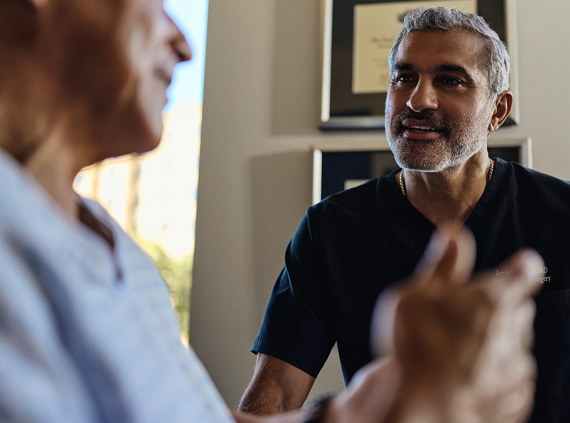 Dr.Karam talking to a patient