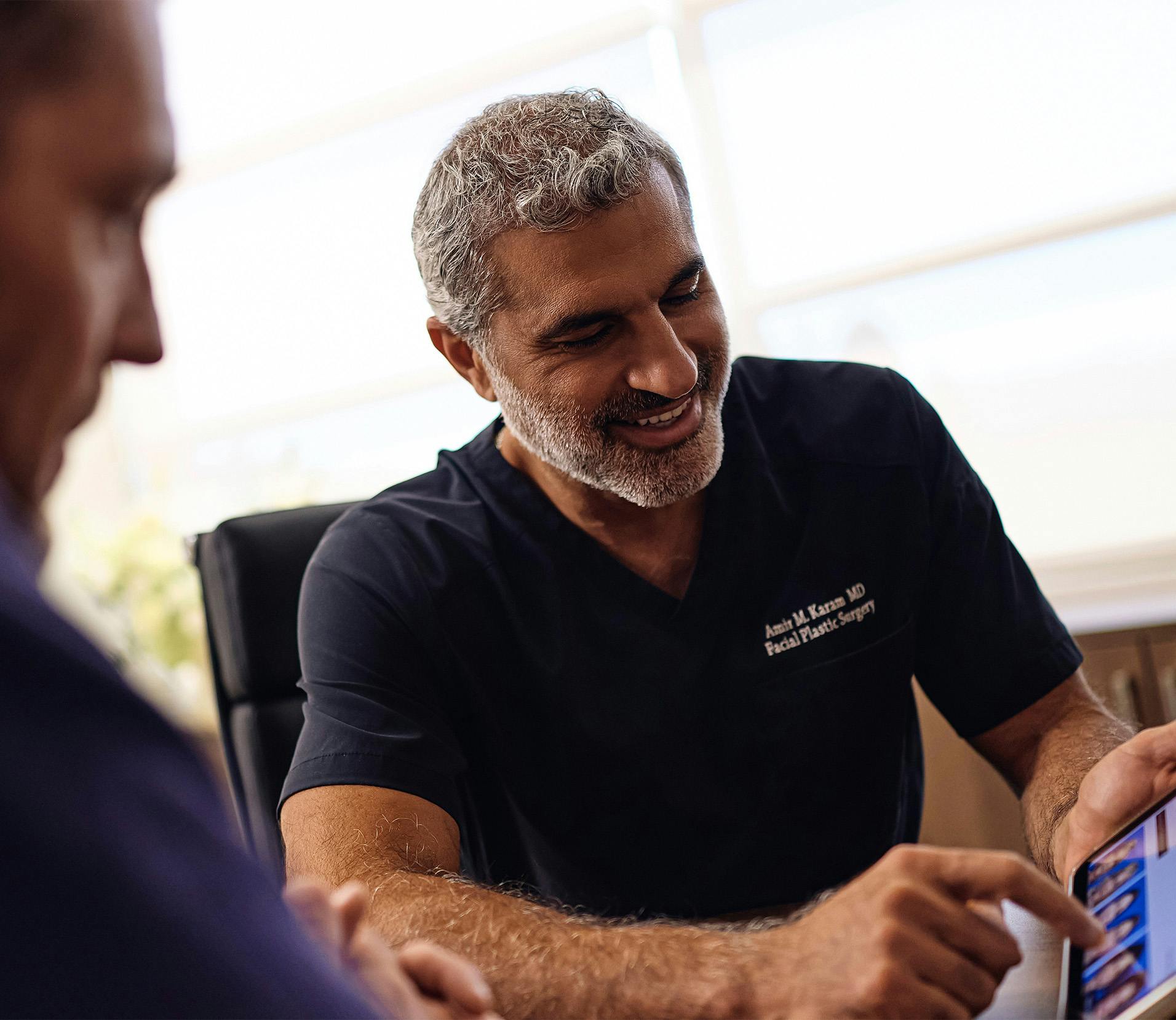 Dr.Karam helping a patient