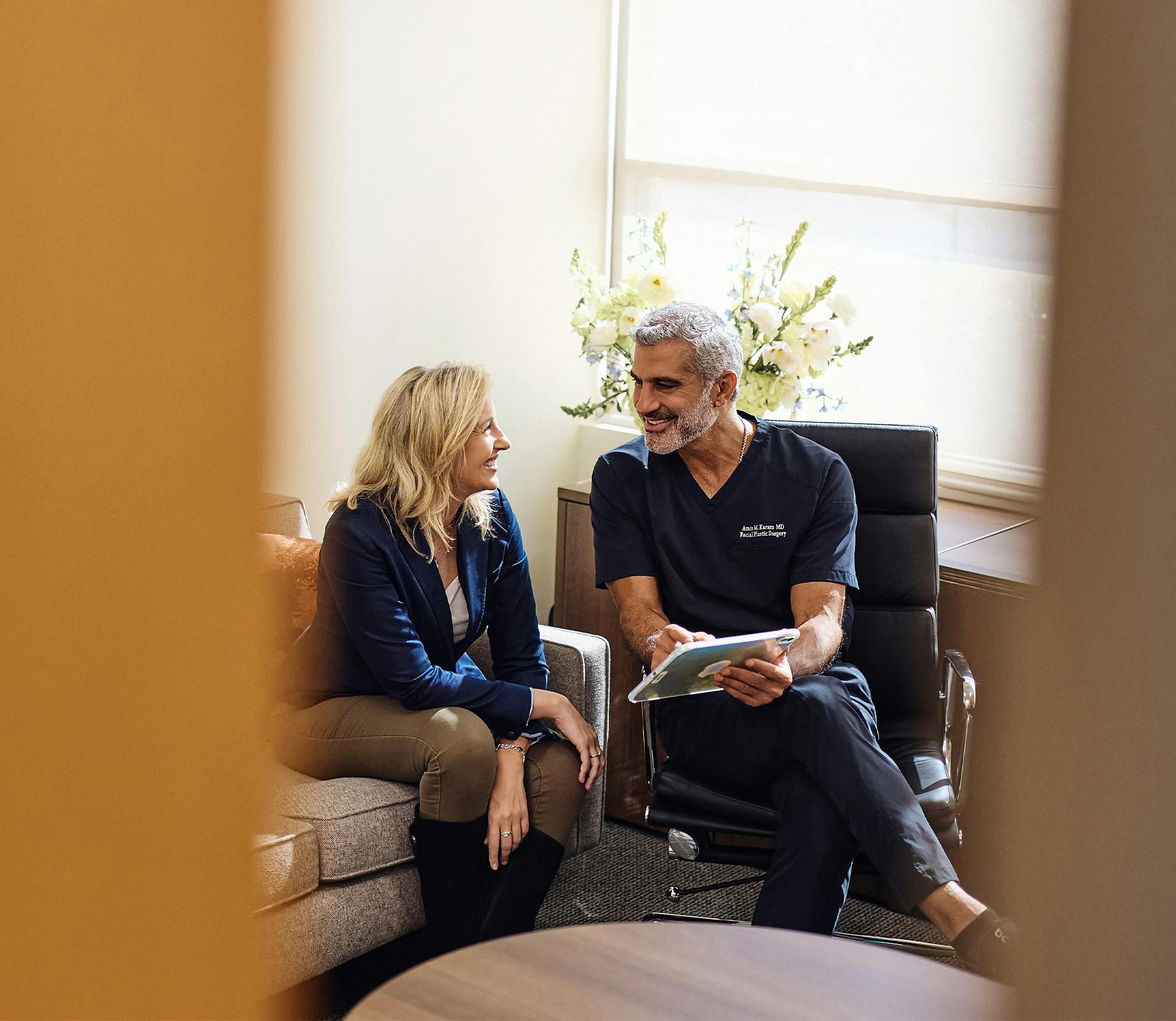 Dr. Karam helping a patient