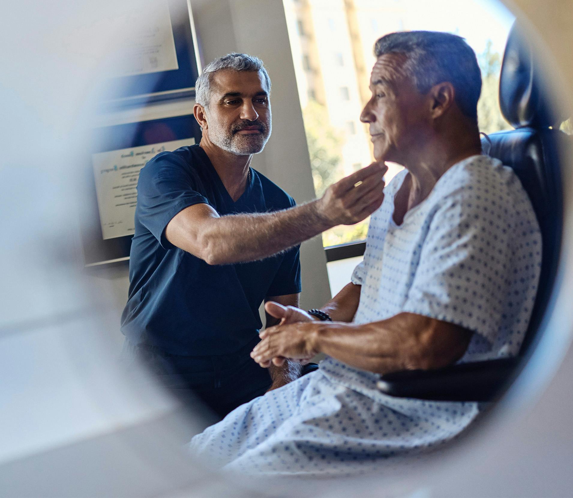 Dr.Karam touching a patients chin