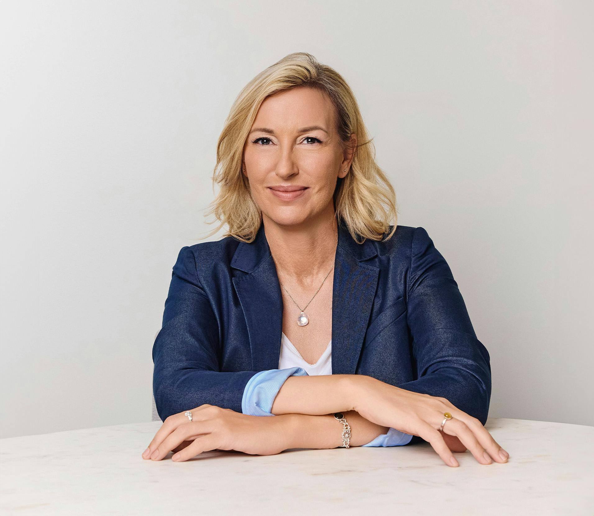 Woman smiling with her hand crossed