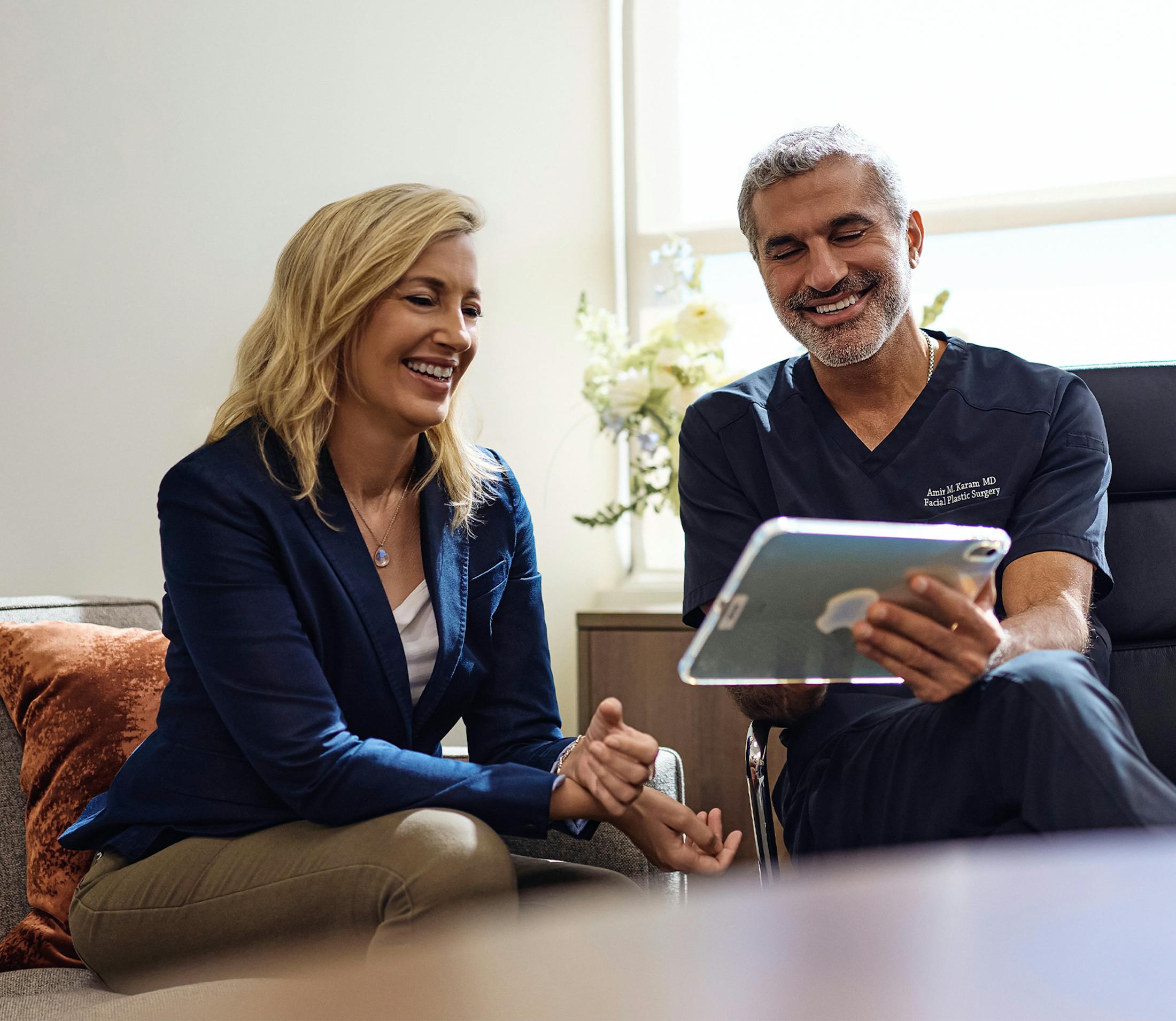 Dr.Karam helping a patient