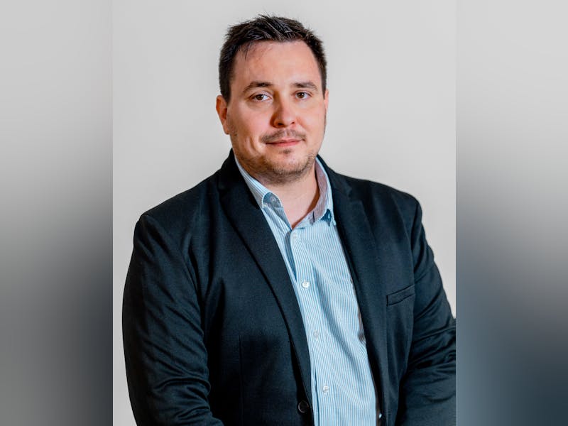Professional portrait of Adam Larsen, a ServiceNow specialist.
