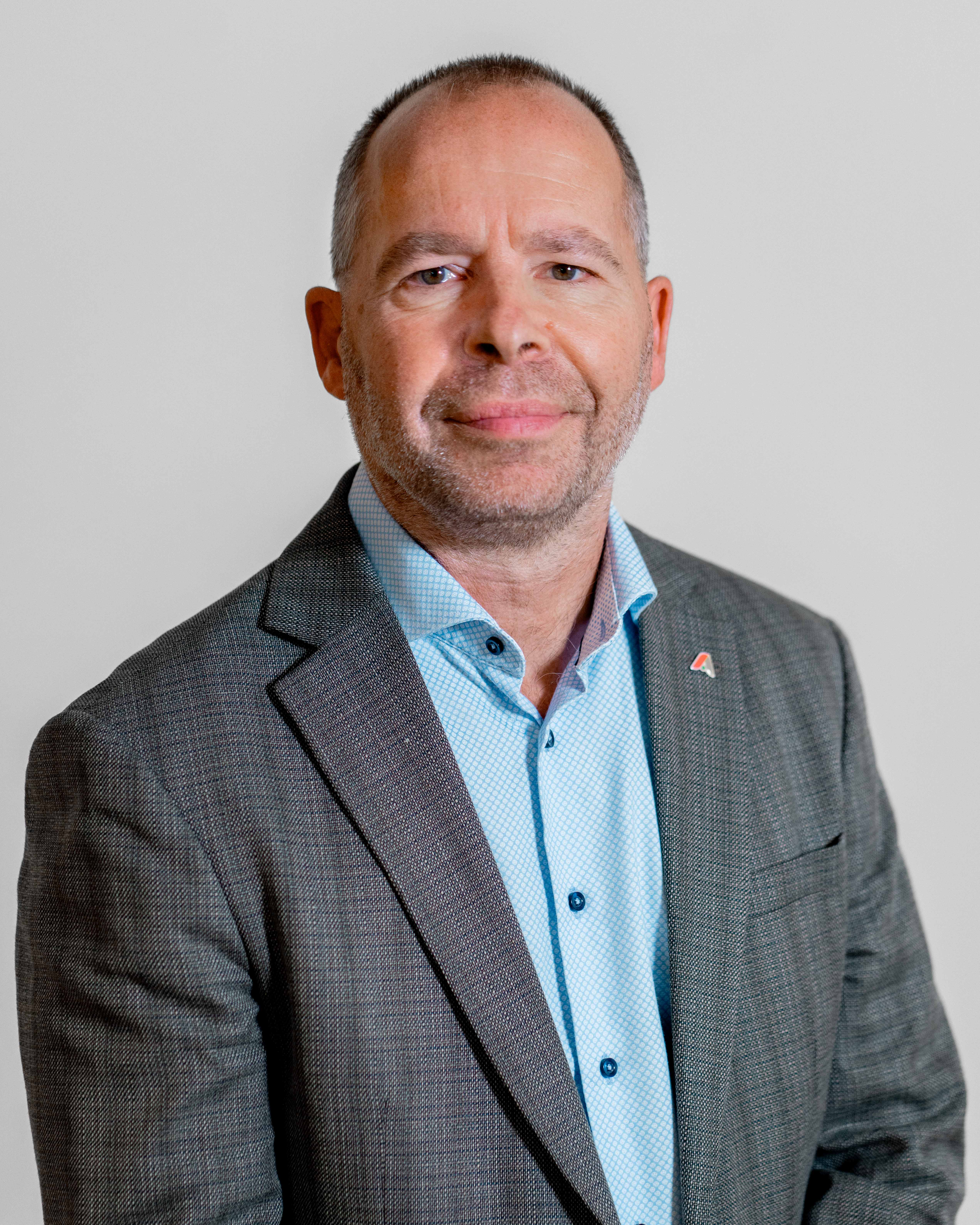 Professional portrait of Claus Hansen from ServiceNow partner Adeno.